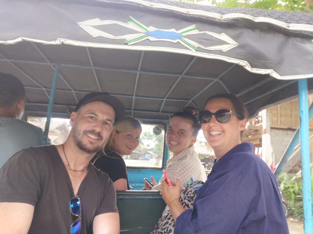 Rhys Sain, Lauren Higgins, Taylor Shepherd, Rhiana Sain on a TukTuk in Coron Town Proper, in the Philippines