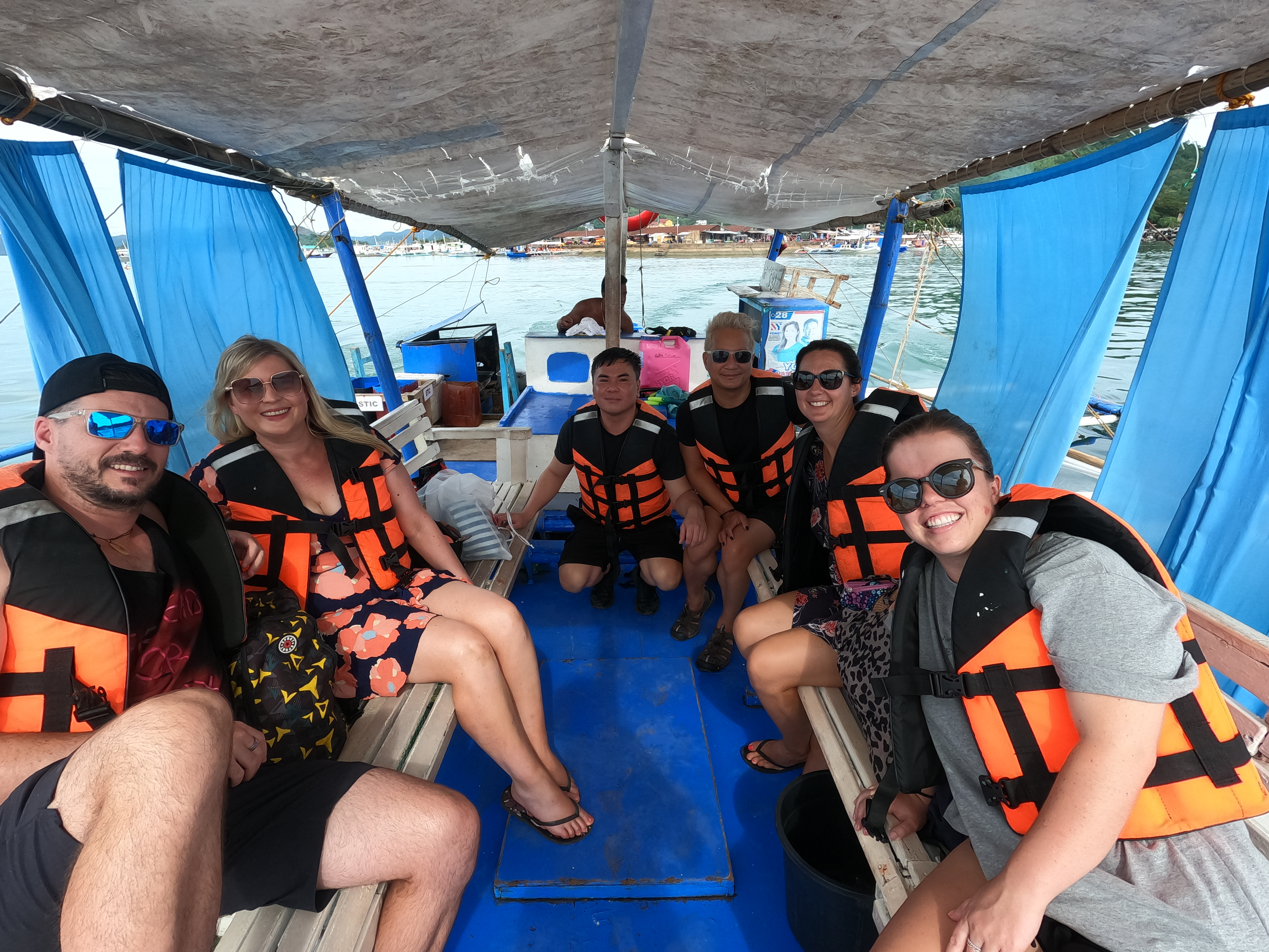Rhys Sain, Lauren Higgins, Taylor Shepherd, Rhiana Ravindran, Jerico Reyes and Wendell Clavin on a boat for our Ultimate Coron Tour