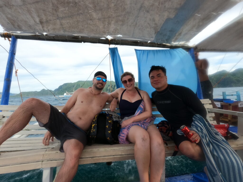 Rhys Sain, Lauren Higgins and Jerico Reyes on a boat in Coron