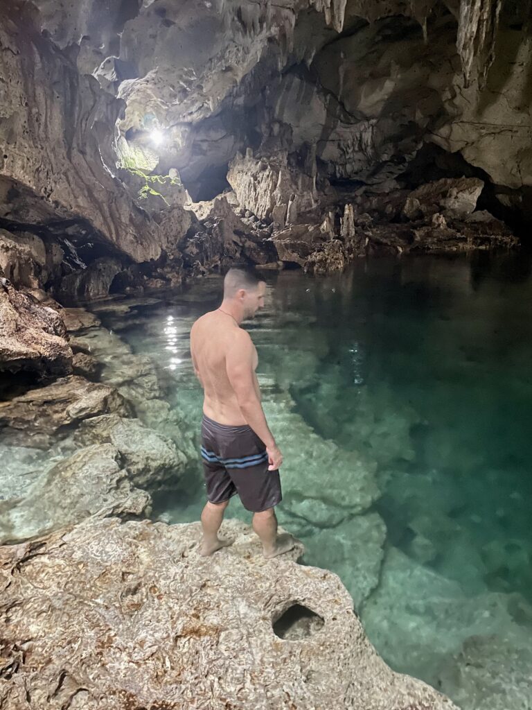 Rhys Alexander Sain getting ready to jump in the water in Hinagdanan Cave  on Panglao Island, Bohol, Philippines
