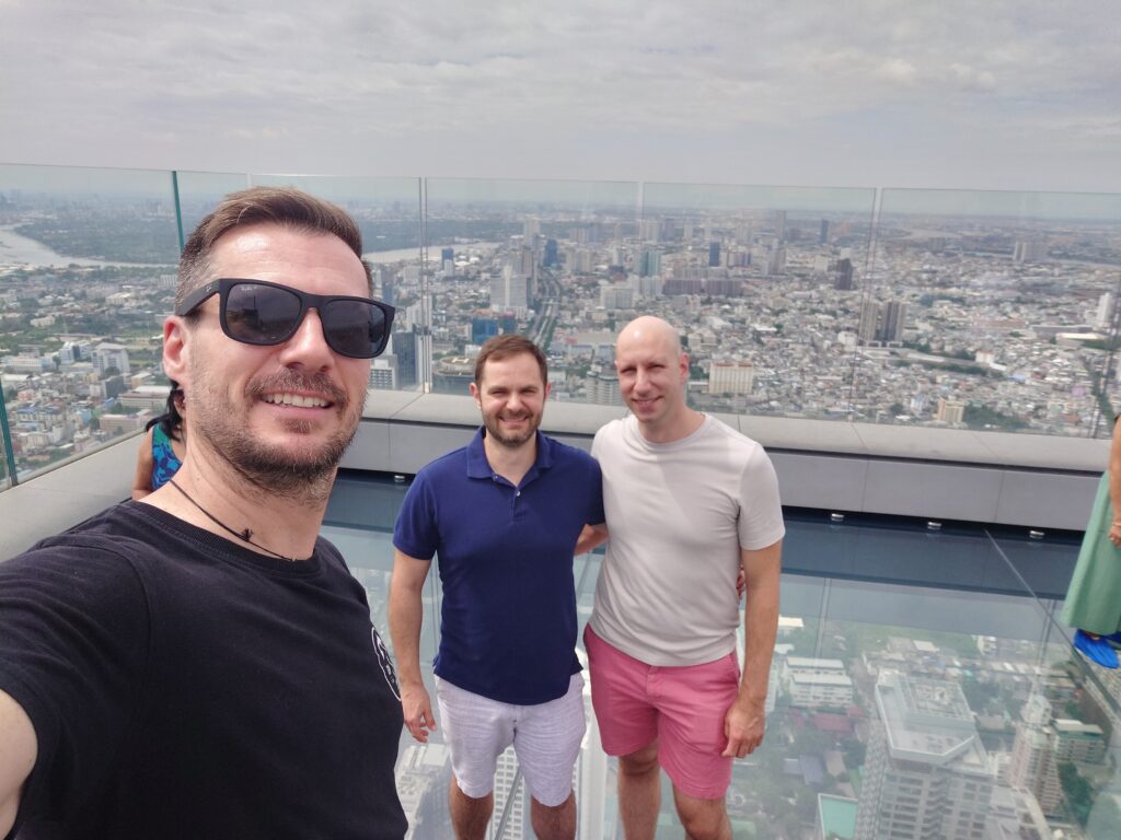Steven Jarczyk, Rhys Alexander Sain and John Benzinger at the Mahanakorn Skywalk. Bangkok, Thailand