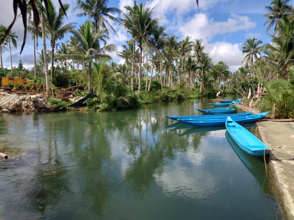 Canoes at the read on Maasin River, Siargao