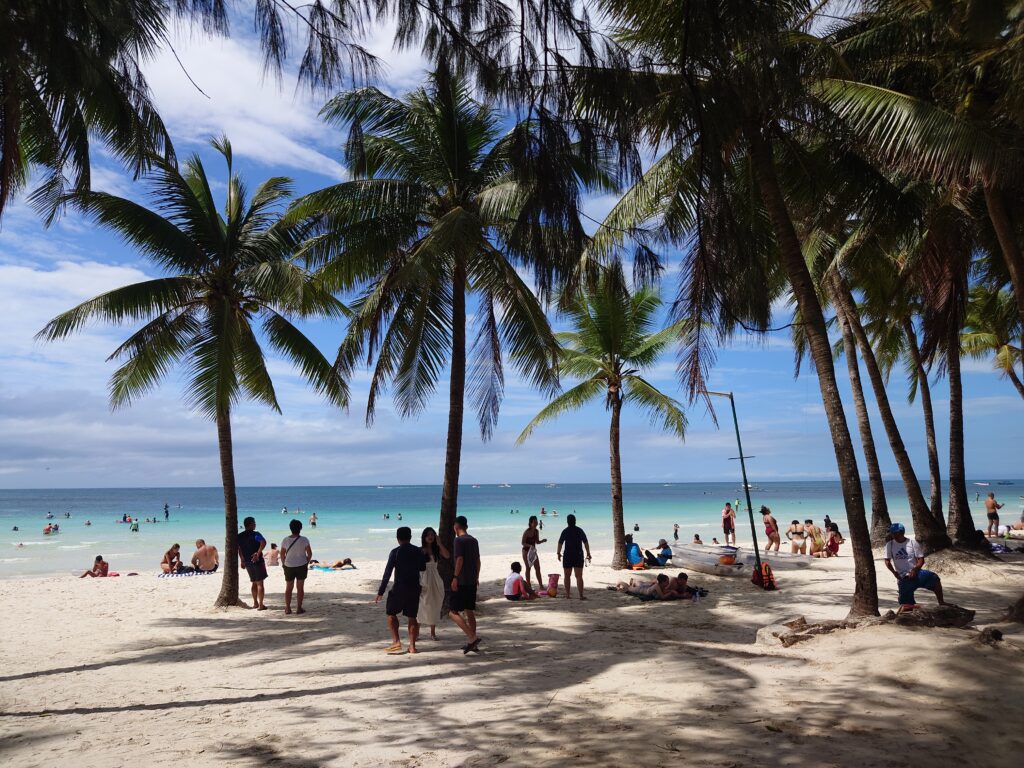 Palm trees along White Beach in Boracay, Philippines