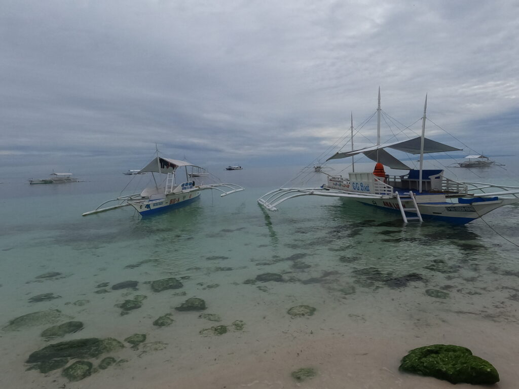 Boats on Alona Beach on Panglao Island, in the Philippines