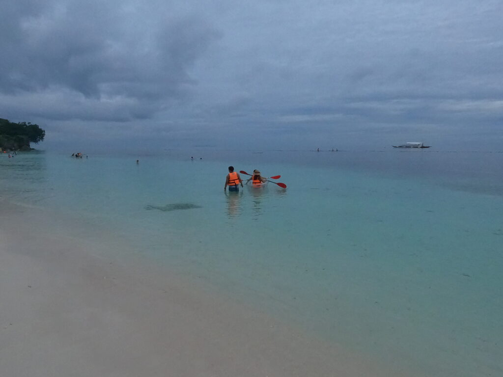 Sea kayaking at Alona Beach on Panglao Island, in the Philippines